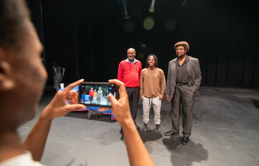 University of Mississippi student, Jordan Isbell, 20, takes pictures of fellow student, Razabier Davis, 20 with left, Donald Cole and Kenneth Mayfield on the stage of Fulton Chapel on Feb. 15.