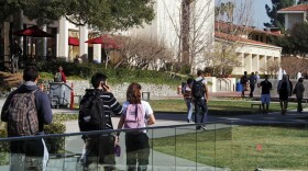 In this Thursday, Feb. 2, 2012 photo, students walk through the campus of Claremont McKenna College in Claremont, Calif.