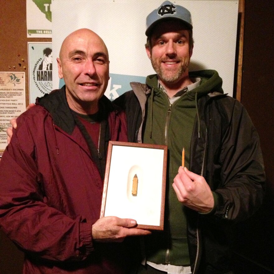 V.I.P. David Rees (right) and artist Dalton Ghetti. Ghetti brought one of his pieces to the show, a tiny boot he carved into the tip of a carpenter's pencil.