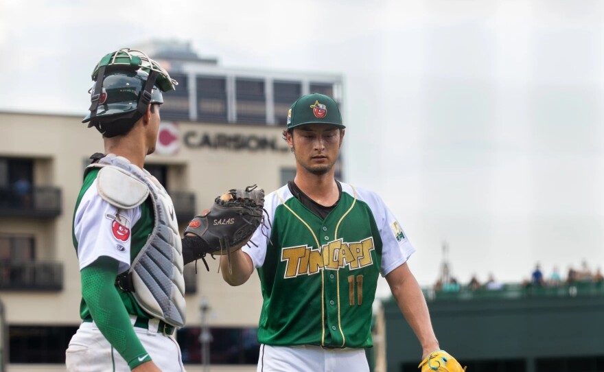 Yu Darvish, 37, greets TinCaps catcher Ethan Salas, 19, at home plate after completing an inning at Parkview Field on June 20, 2024.
