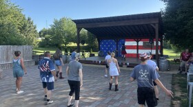 Leather ‘N Lace Dance Club members gather at Plaza Antigua earlier this month for an Independence Day-themed hoedown.