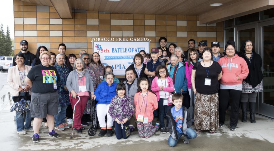 This photo was also taken in 2018 at the 75th Anniversary of the Battle of Attu and a commemorative luncheon hosted by the Aleutian Pribilof Island Association. Elizabeth Kudrin, Gregory Golodoff’s younger sister, is seated in her wheelchair in the middle among descendants of Attu Islanders. Her brother, Gregory, is the second person standing in the third row to her right, wearing a maroon cap.