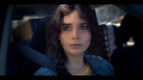 Magdaliz Rivera, a Syracuse University alumn starring in NY Emmy nominated film "Spiral" gazes out the window of a car.