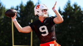 Syracuse starting quarterback Steve Angeli (9, Black) throws in a fall practice.