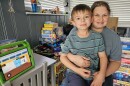  Erin Booth, and her 8-year-old son Landon, sit in the toy room of their Lake Como home. The two are surrounded by toys donated to Landon while he underwent Chemo treatments. In 2021, Landon was diagnosed with Leukemia.  The two received a Medicaid redetermination letter from DCF last March, despite the agency saying patients with complex medical conditions would be last to be evaluated in 2024.