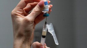 FILE - Lauren Ellenburg, a nurse, prepares a combination measles, mumps and rubella vaccine for a patient at Tiger Pediatrics in Easley, S.C., March 17, 2026. (AP Photo/Mary Conlon, File)