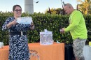 Holly Vingson-Ruiz (l.) and Paul DeMello (r.) release butterflies in Baker Park as part of the Twins Tot Vigil. Vingson-Ruiz's son drowned in 2018; DeMello's twin sons drowned in 2010.