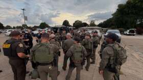 Authorities gathered on the Mt. Vernon High School parking lot in the 600 block of Mulberry St. to arrest a felony suspect, July 16, 2026