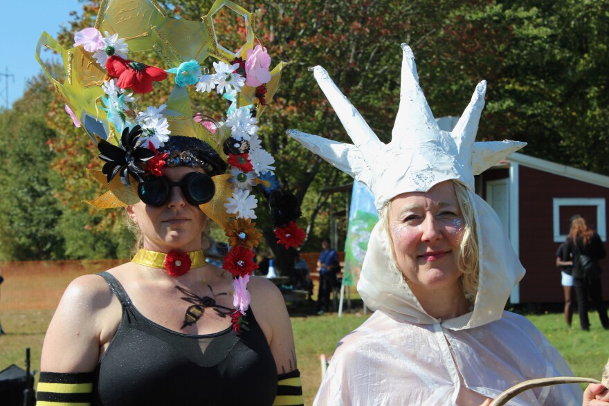 Two protesters dressed as the Bee Queen and Queen of the North to highlight the impacts of climate change.