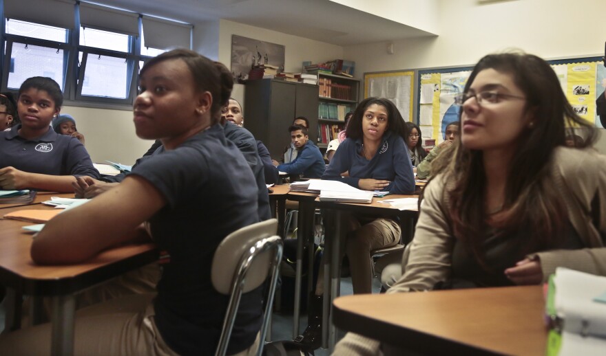 Students participate in a lesson.