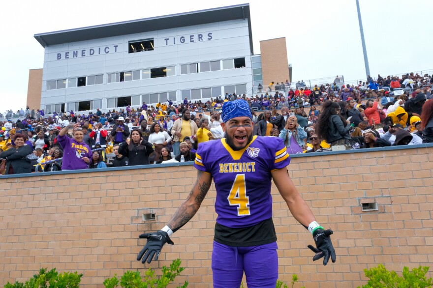 Fern Romero III, a graduating senior and a defensive back on the Tigers' football team, cheers on his teammates from the sidelines before returning to the field during the school's homecoming game against the Clark Atlanta University Panthers on Oct. 29, 2022.