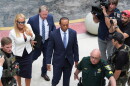 Golfer Tiger Woods, right, arrives with Vanessa Trump, left, for Woods' plea conference 