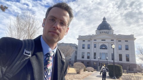 Lee Strubinger, of South Dakota Public Broadcasting, is shown in an image of February 2025, as he covers issues in the South Dakota Legislature.