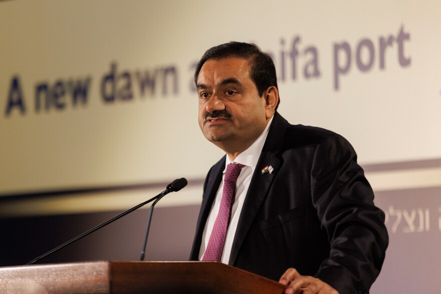 Gautam Adani, billionaire and chairman of Adani Group, speaks during an event at Israel's Port of Haifa, on Tuesday. The Indian billionaire, whose business empire was rocked by allegations of fraud by short seller Hindenburg Research, said his company will make more investments in Israel.