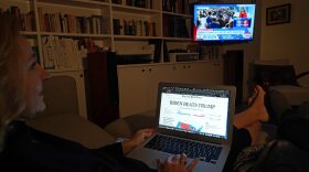 The photographer and his wife watch CNN as U.S. media confirm their projection of a win by Democrat Joe Biden in the U.S. presidential election.