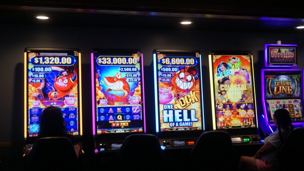Casino slots shine in a dimly lit room