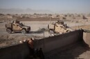 U.S. soldiers enter a compound for a security meeting in Shah Joy District, Zabul Province, Afghanistan in the fall of 2010.
