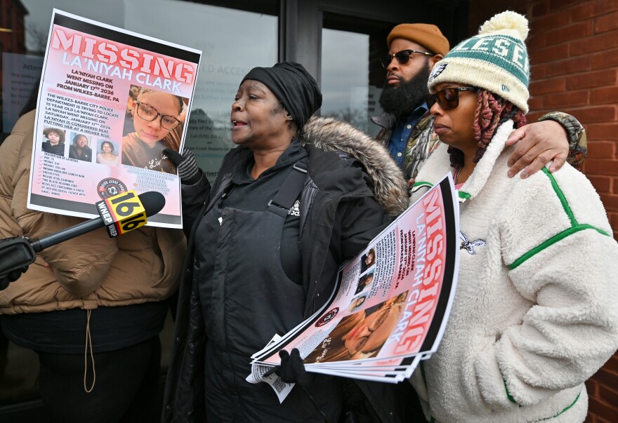 The adopted family of La'Niyah "Lala" Clark stand outside the Wilkes-Barre Police Department, including, from left: grandmother Carmen Tinson, father Antione Clark, and mother Ameerah Woods.