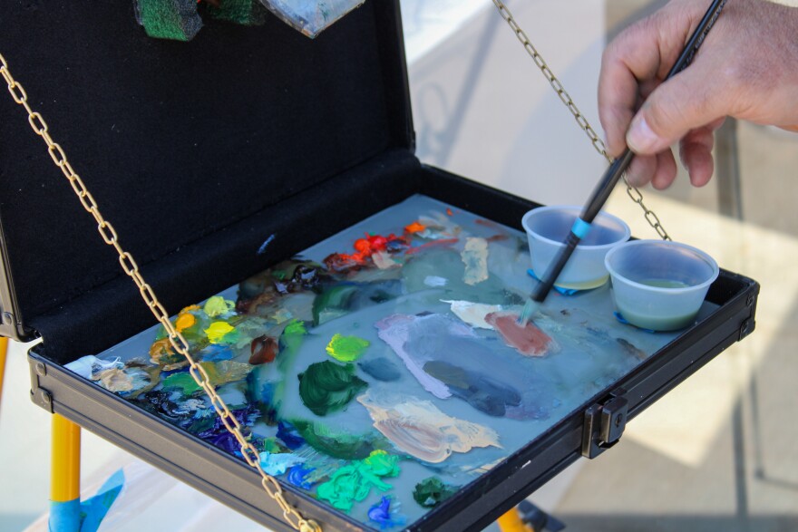 Richard Davies working on his oil painting at the Bartlett Arboretum.