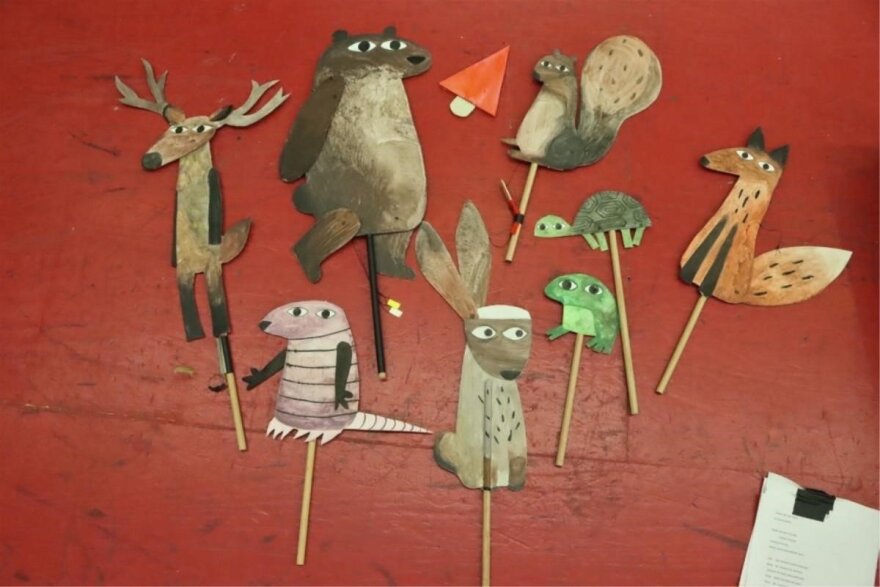 Shadow stick puppets based on "I Want My Hat Back, a 2011 children’s picture book by author and illustrator Jon Klassen. The characters are fox, bear, turtle, rabbit, and the script is included.