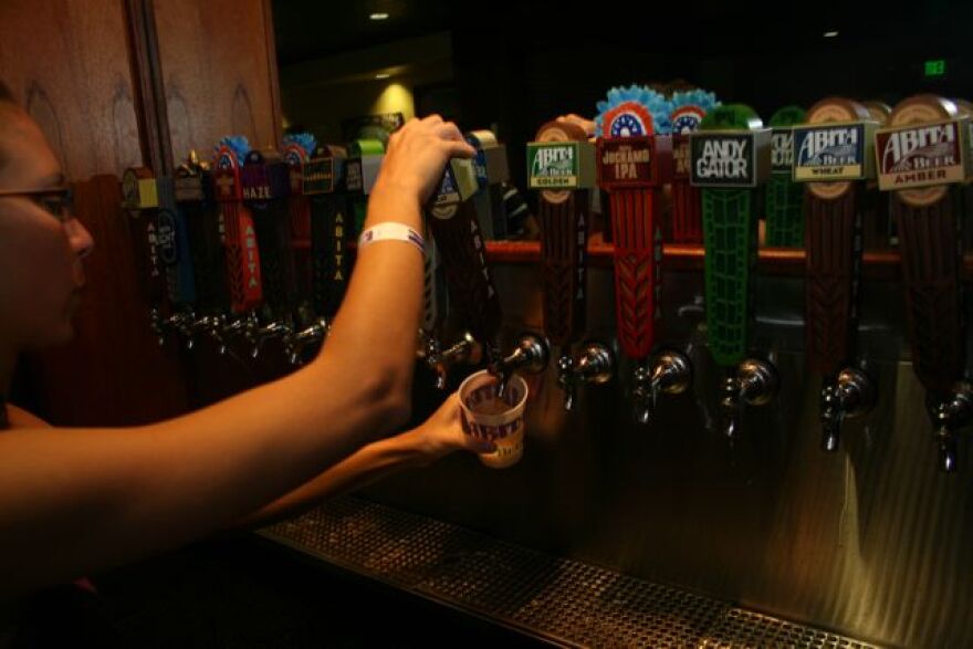 Taking a pull at the Abita Brewing Co.'s plant tour in Abita Springs.