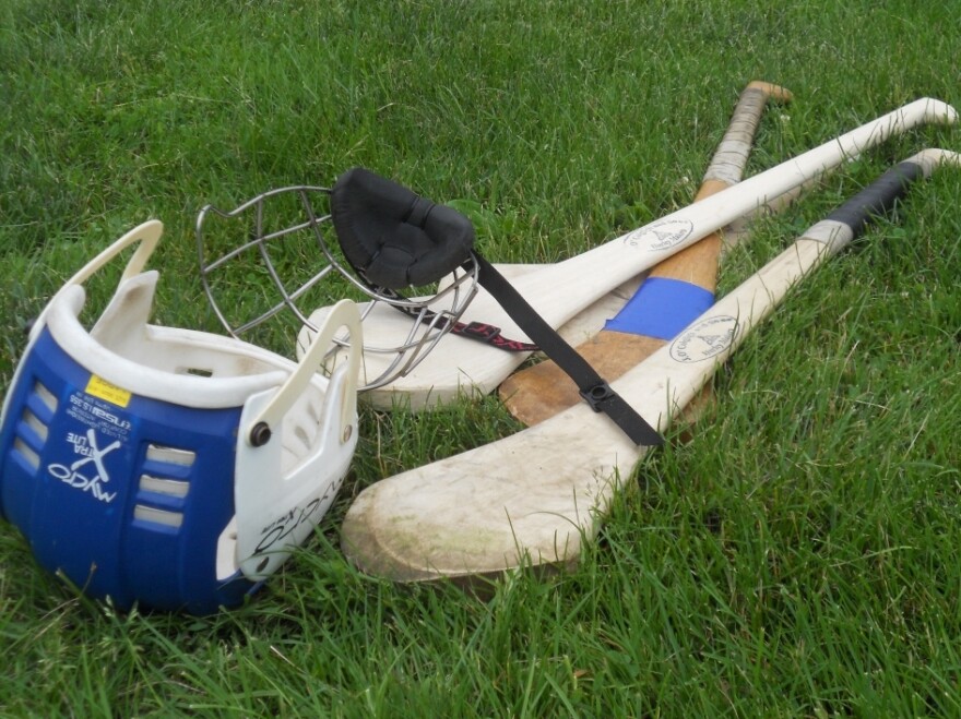 Hurling gear consists of a helmet, a wooden stick made of ash called a hurley,  and a ball called a sliotar.