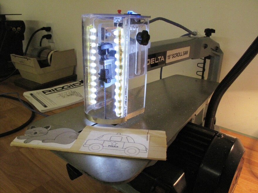 David Butler designed his safety brakes so they could be easily installed on existing saws and machine tools. This prototype is installed on a Delta 15-inch scroll saw, a model that has been used for decades in schools.