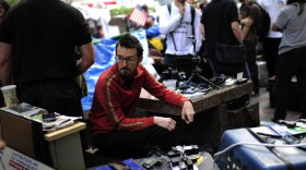 Occupy Wall Street volunteers man a communication station in Zuccotti Park near Wall Street on Oct. 11. The media team monitors Twitter and Facebook and oversees the group's Livestream feed.