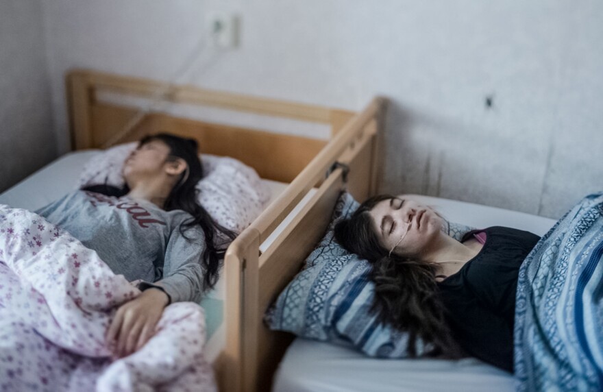 Two refugee children who show the symptoms of <em>uppgivenhetssyndrom</em>, or resignation syndrome.