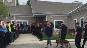 Ciro, a retired police dog, is led into the Pittsfield Veterinary Hospital for his last call.