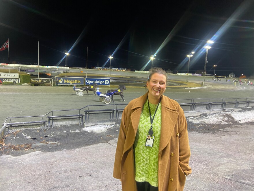 Hedda Skappler runs the responsible gaming division of Norsk Rikstoto, the state-owned horse-racing company. Here she stands in front of a race at the Oslo tracks, where the stands were mostly empty as most people gamble through mobile apps.
