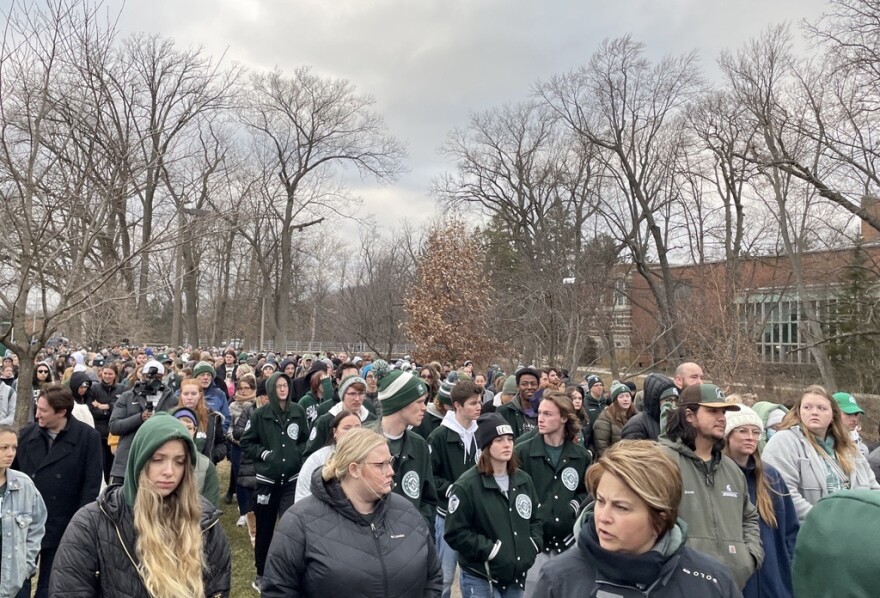 Community members wearing MSU's colors head East from the Spartan Statue towards the Rock.