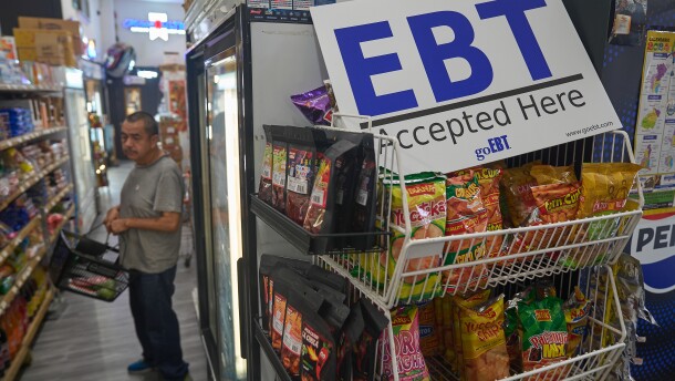 FILE - A banner reads: "EBT (Electronic Benefit Transfer) Accepted Here," at El Recuerdo Market in Los Angeles, Oct. 31, 2025, after two federal judges ordered President Donald Trump's administration to continue funding SNAP during the government shutdown. (AP Photo/Damian Dovarganes, file)