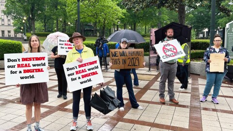 Residents protest outside Birmingham City Hall in advance of a meeting in which the City Council will consider proposed regulations for data centers.