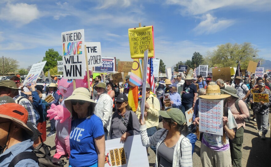 Protestors march at the Albuquerque No Kings march on Saturday.