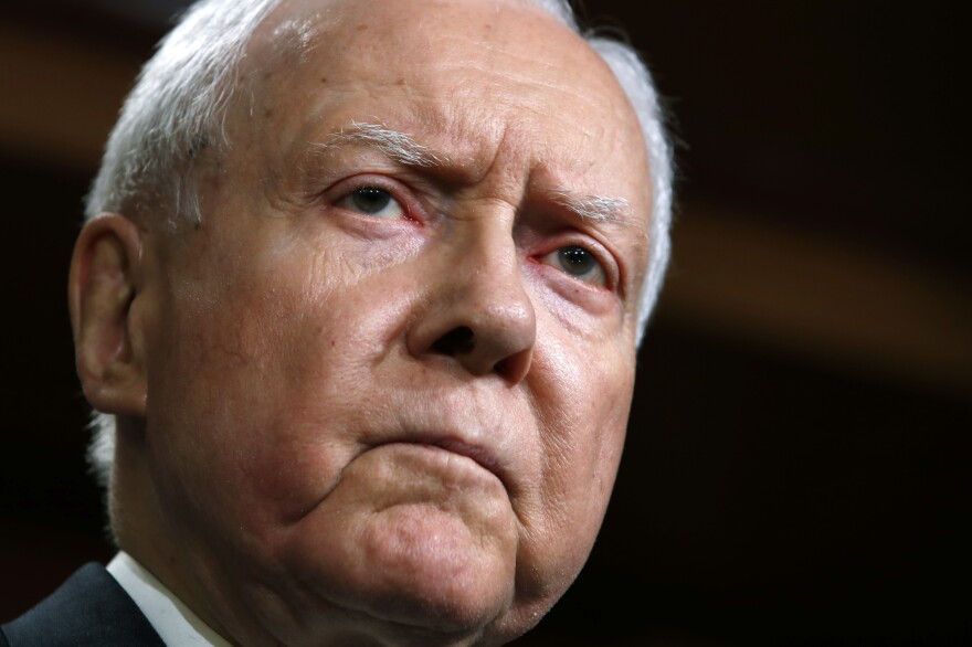 Then Sen. Orrin Hatch, R-Utah, is seen at a news conference with Republican members of the Senate Judiciary Committee on Capitol Hill in 2018. A longtime senator known for working across party lines, Hatch died Saturday at age 88.