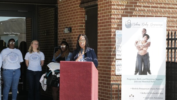 Stephanie Spencer, founder of Urban Baby Beginnings, calls for transparency in the state’s perinatal health hub program on April 11.