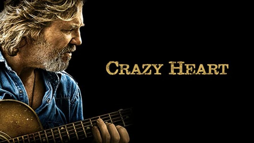 Jeff Bridges strums a guitar in the poster for "Crazy Heart."