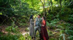 Director Chloé Zhao with actors Paul Mescal and Jessie Buckley with on the set of their film "Hamnet." (Courtesy of Agata Grzybowska/© 2025 Focus Features LLC)