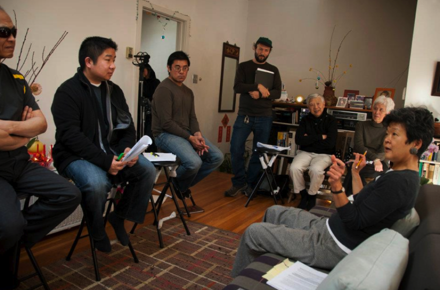 Artistic director Rene Yung (right) gives instructions to the proxy storytellers during a rehearsal of the theater and oral history project “Chinese Whispers." Photo courtesy of Chinese Whispers