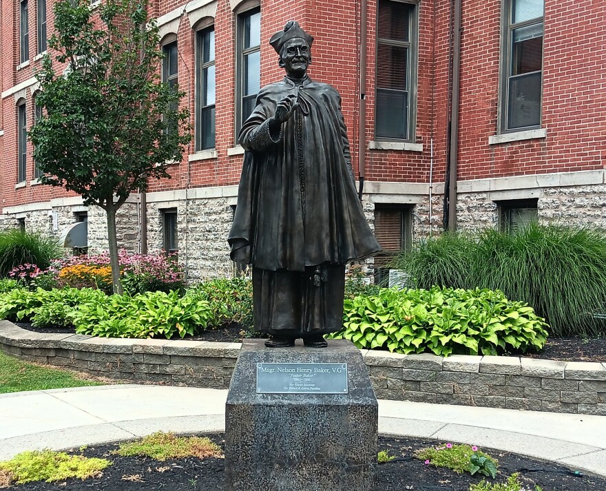 A statue of the late Father Nelson Baker stands near the corner of South Park and Ridge Road in Lackawanna outside Our Lady of Victory Charities.
