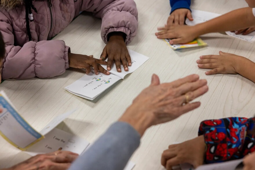 Students work with a volunteer, taking turns reading out loud to one another, during Bookworms at Fort Worth ISD’s E.M. Daggett Elementary, on Jan. 22, 2026.