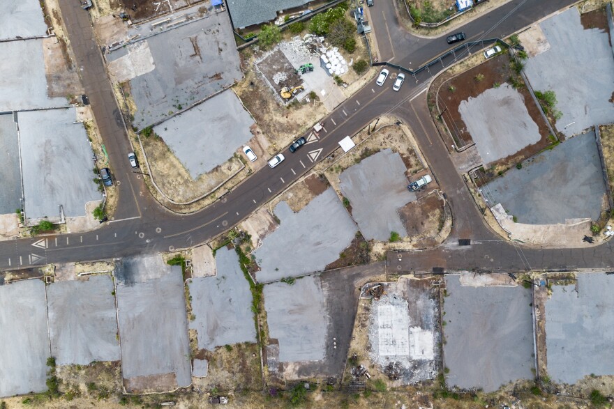 An aerial view shows the burn zone along Lahainaluna Road after the completion of residential primary debris removal on Saturday, July 6, 2024, in Lahaina, Hawaiʻi. (AP Photo/Mengshin Lin)