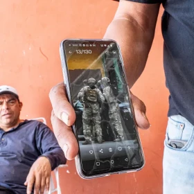 Francisco Gonzalez-Jasso shows the video of his arrest by federal agents in Chicago. The video circulated on social media, spreading word of his arrest and deportation before he arrived back home.