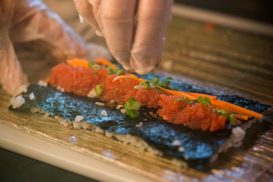 Scallions provide the finishing touch on this roll. Note: Don't smush your rice as much as we did here.