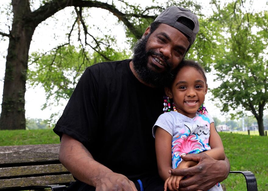 Poet Sam Stokes poses with his granddaughter Ivy in Cleveland's Luke Easter Park. [Margaret Cavalier / ƽ]