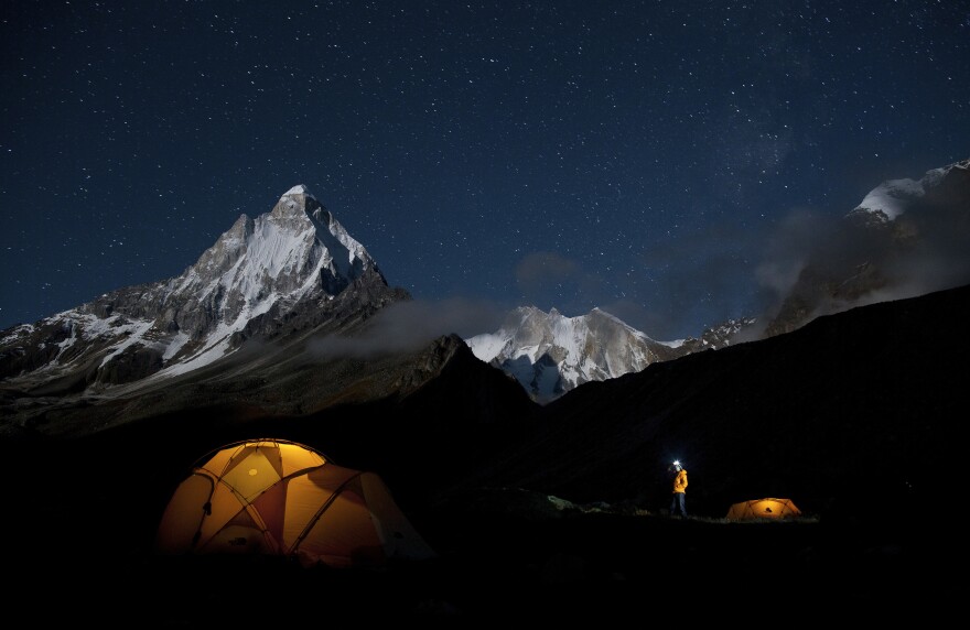 Renan Ozturk looks at the stars above base camp during the 2011 Meru expedition.