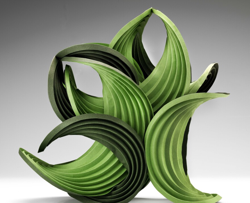 <em>Green Balance </em>is a 2011 work by <a href="http://40u40.beancreative.com/artist08.html">Erik Demaine</a> and his father, Martin Demaine. As a scientist, Erik Demaine says he works to "explore curved creased folding from both a mathematical and an artistic perspective."