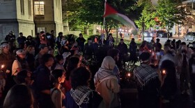 A candlelight vigil for Palestine at IU's Sample Gates.