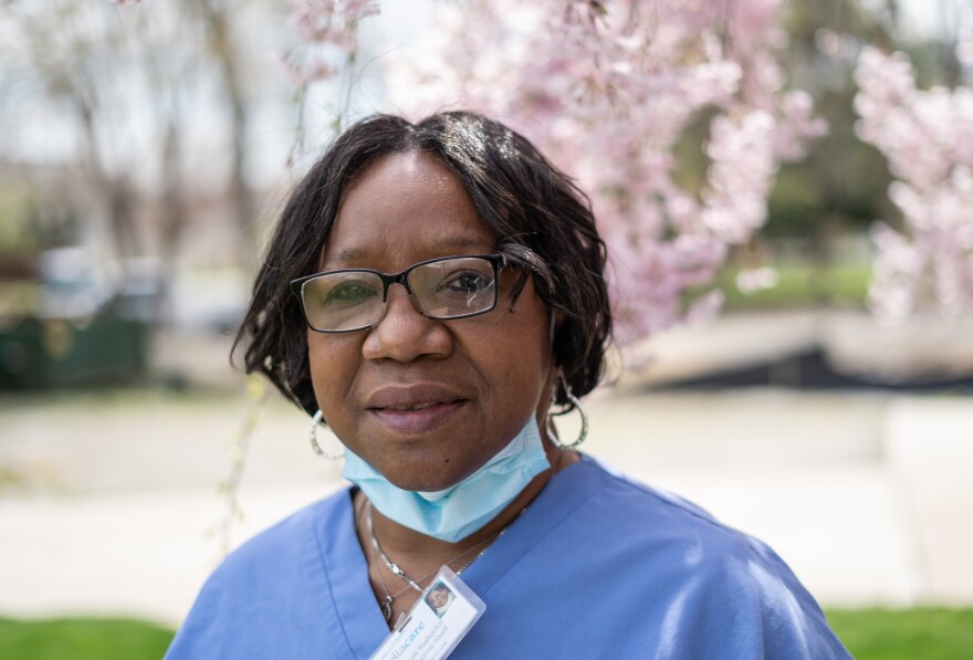 Excellacare Care Provider Sarah Sutherlin stands outside the home of her client's home in Brownstown on Wednesday, April 14, 2021.